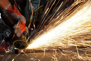 9309941-sparks-while-grinding-in-a-steel-factory-Stock-Photo-grinding-welder-metal